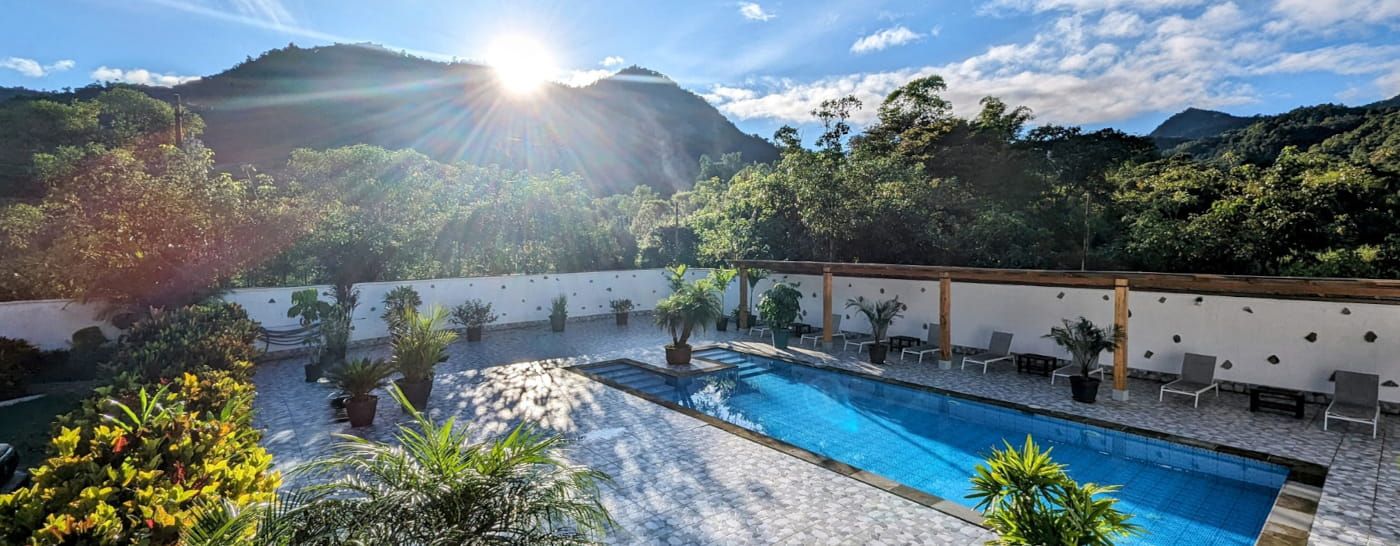 Pool and terrace of Las Terrazas de Dana facing the cloud forest valley